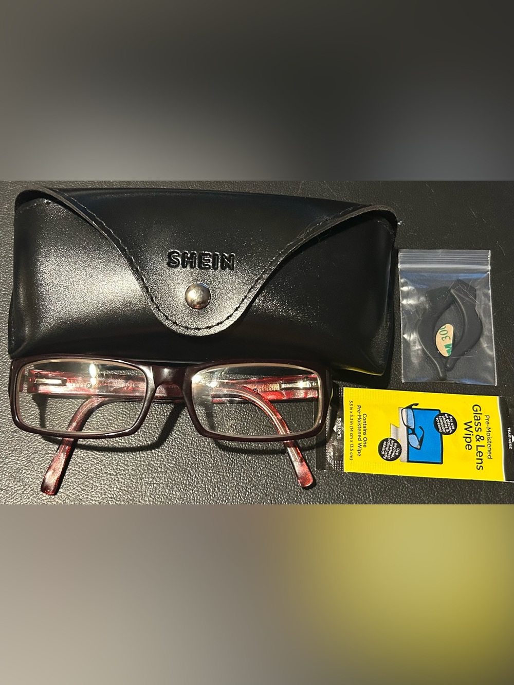 The Edge TE71 Red Wine Colored Eyeglasses With Case, Ear Grips, & Nose Grips.